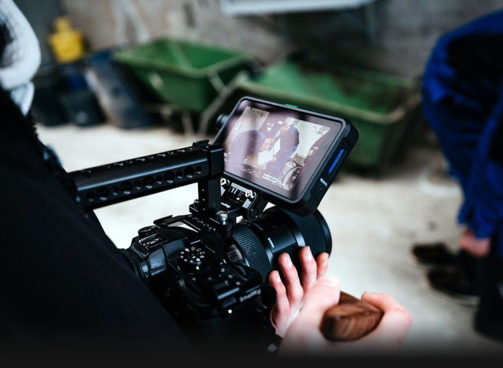 a camera being used to film workers